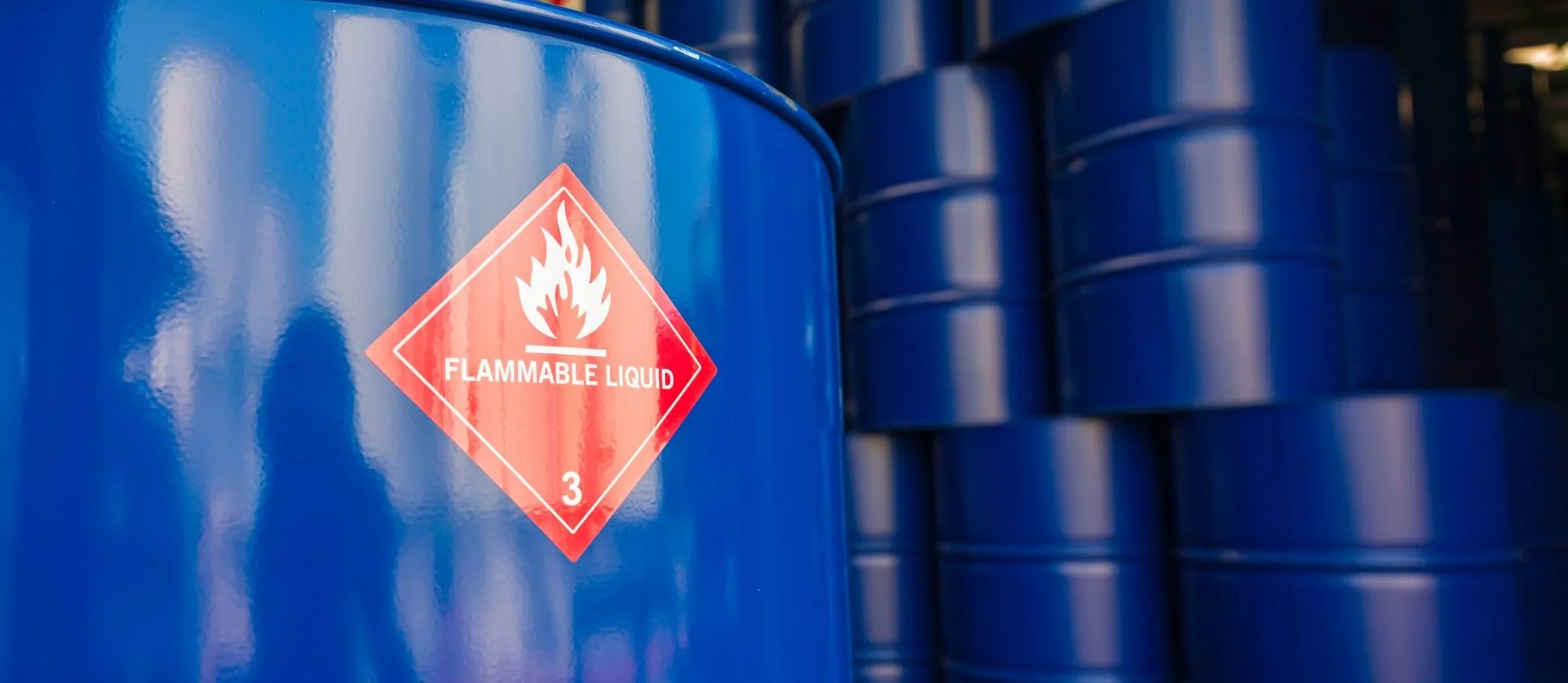 Flammable liquid drums used to demonstrate an example of dangerous goods that could be referenced in Dangerous Goods by Air certification training.